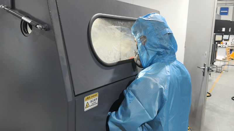 SLS part depowdering and bead blasting